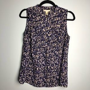 Used cute sleeveless, purple base top.